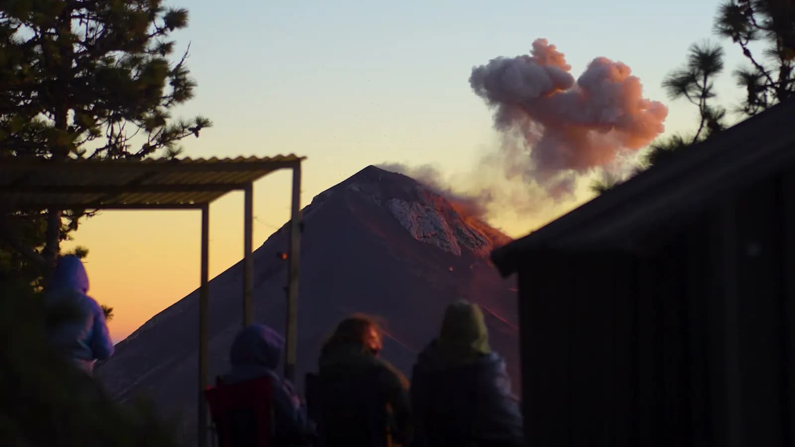The Acatenango camp at sunset with Volcán de Fuego erupting beyond